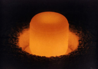 A glowing pellet of plutonium fuel. (Photo: US Department of Energy)